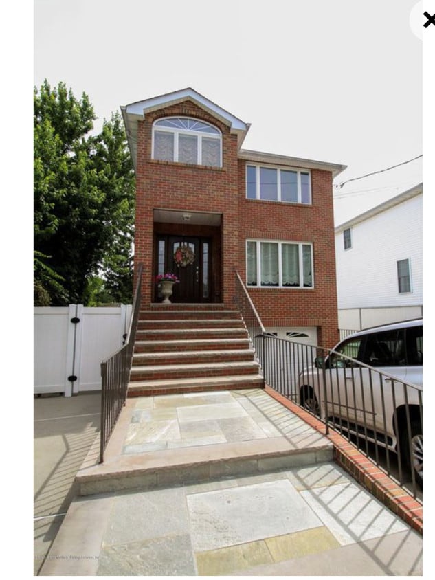 Apartment entry on left side of house - 119 Yetman Ave