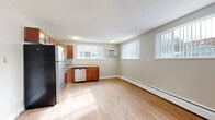 This 1-bedroom, 1-bathroom unit in Englewood, Colorado offers a functional and comfortable layout across a single floor. The open-concept living and dining area is bright and inviting, featuring light hardwood-style flooring, neutral beige walls, a textured ceiling, and multiple windows that allow natural light to fill the space. A baseboard heating system runs along the perimeter, ensuring year-round comfort.

The kitchen is well-equipped with warm wood cabinetry, granite-look countertops, and stainless steel appliances including a gas range, dishwasher, and refrigerator. A wall-mounted air conditioning unit and additional windows make this an airy and practical cooking space.

The bedroom offers a cozy retreat with plush carpeting, a ceiling fan with light fixture, a window for natural light, and access to a closet. Two additional closets throughout the unit provide generous storage options.

The bathroom features a tub/shower combination with full-height tan tile surround accented by a decorative mosaic tile border, a white vanity with brushed nickel fixtures, and a mirrored medicine cabinet. Clean, understated finishes throughout give this unit a tidy and move-in-ready feel.