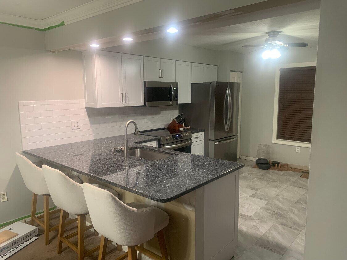 The new flooring is nearly finished. And, the sink has touchless, motion activated, faucet. - 704 Carters Grove Dr