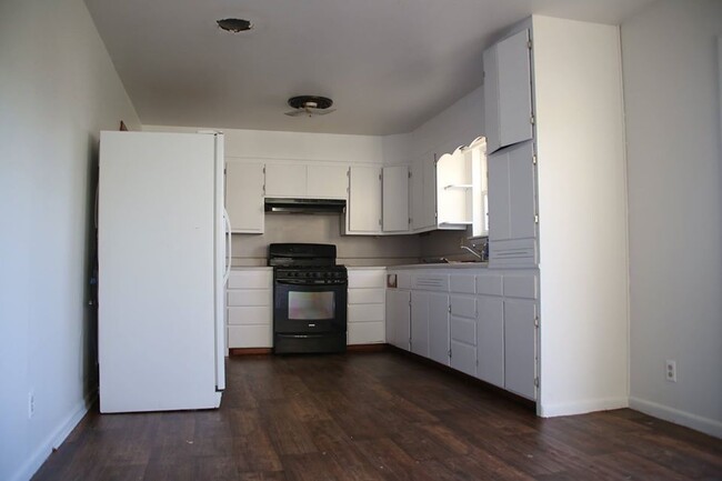 KItchen includes gas stove, dishwasher and refrigerator/freezer - 1605 Wilson St