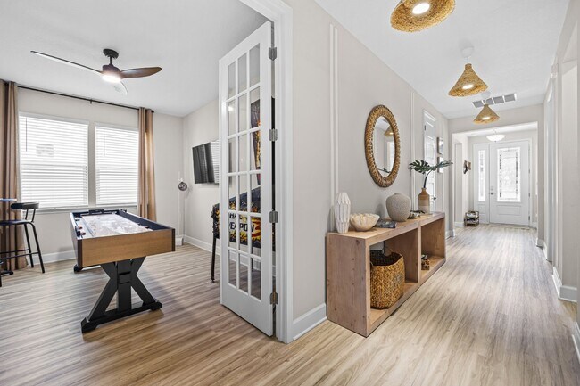 Foto del edificio - "Luxurious Furnished Home with 4-Bed, 3-Bath, Swim Spa Fenced Yard Golf Cart steps to the beach!"