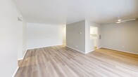 Located at 1414-1422 Som Center Rd in Mayfield Heights, Ohio, this single-floor residence offers 3 bedrooms, 2 bathrooms, and a well-organized layout designed for comfortable everyday living. Light-toned luxury vinyl plank flooring runs throughout the main living areas, creating a clean and cohesive aesthetic. The spacious living room is highlighted by a ceiling fan and a sliding glass door that opens to a private balcony, allowing natural light to fill the space. An adjacent dining area flows seamlessly toward the kitchen, which features white shaker-style cabinetry, marble-look countertops, and stainless steel appliances including a gas range and full-size refrigerator. The three bedrooms are carpeted for warmth and comfort, each offering closet storage and windows with vertical blinds. The generously sized primary bedroom provides ample space and easy access to a dedicated closet area. Both bathrooms are finished with white tile wainscoting, white vanities, and light wood-look flooring, offering a clean and functional design. A dedicated utility room adds practical storage and functionality. With four closets throughout, a welcoming entrance, and a connecting hallway, this residence provides a practical and comfortable living environment.