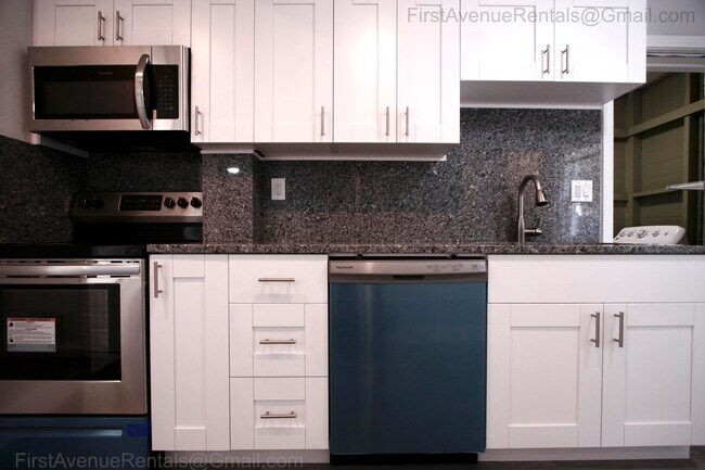 Kitchen, stainless range, microwave, dishwasher, refrigerator, granite counter and full backsplash. Solid wood cabinets - 5001 1/2 1st ave N