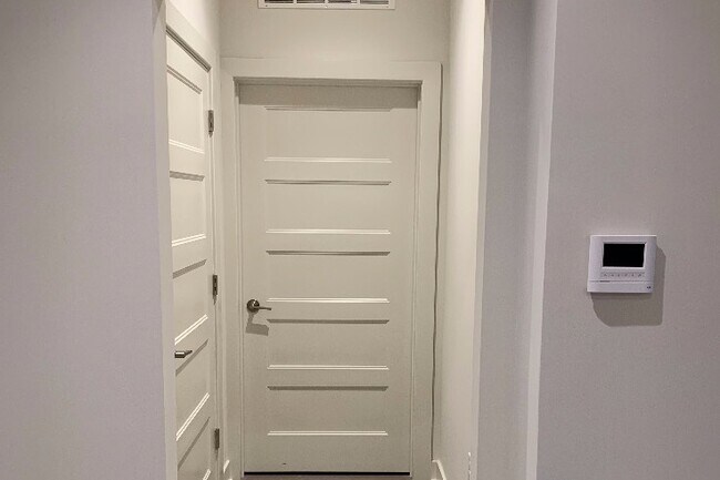 Coat closet and utility closet with storage - 575 S Goddard Blvd