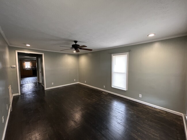 Living room with updated lighting and fan - 1406 Spruce St