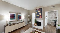 Located in the Briarforest neighborhood of Houston, TX, this well-appointed one-bedroom, two-bathroom residence offers a smart and functional single-level layout. The living room serves as the heart of the home, featuring warm wood-look flooring, neutral taupe walls, and large sliding glass doors that invite abundant natural light and provide direct outdoor access. The adjacent dining area is a defined, cozy space ideal for intimate gatherings, while the kitchen is fitted with white cabinetry, white appliances, a double sink, and clean tile flooring — with the added convenience of an in-unit washer included. The bedroom is generously proportioned, finished with plush carpeting, a ceiling fan, and access to a spacious walk-in closet outfitted with dual hanging rods and built-in shelving on all sides, offering exceptional storage. Two bathrooms serve the unit, one featuring a wide vanity with a full-width mirror and tile flooring. Throughout, the warm neutral color palette and consistent finishes lend a cohesive, comfortable ambiance. This residence strikes a practical balance between efficient use of space and everyday livability in a well-connected Houston location.