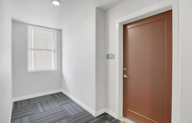 Building Photo - Modern Ground-Level Condo in River Terrace...