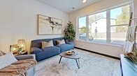 Located at 808 Melvin Ct, Unit 112 in Madison, WI, this thoughtfully designed 640-square-foot, one-bedroom apartment offers a modern open-concept layout across a single floor. Light hardwood-style flooring flows throughout the main living area, complementing the clean, contemporary aesthetic.

The kitchen serves as a central hub of the unit, featuring a large island with a built-in sink, light quartz countertops, and bar seating for multiple guests. Taupe cabinetry pairs with stainless steel appliances, including a refrigerator and range, while pendant lighting above the island adds a stylish focal point. The kitchen opens seamlessly into the living room, which benefits from a large window that allows ample natural light and outdoor views.

The 140-square-foot bedroom is a comfortable retreat, featuring a generously sized window with outdoor views, a walk-in closet with built-in shelving, and neutral wall tones that create a calm atmosphere. A dedicated laundry area includes a full-size Whirlpool front-loading washer and dryer set, complete with overhead wire shelving for additional storage. Bold black interior doors and trim provide a striking contrast against the bright white walls, lending the unit a modern, intentional design character throughout.