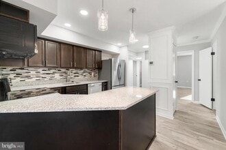 Building Photo - 8103 Greenspring Way