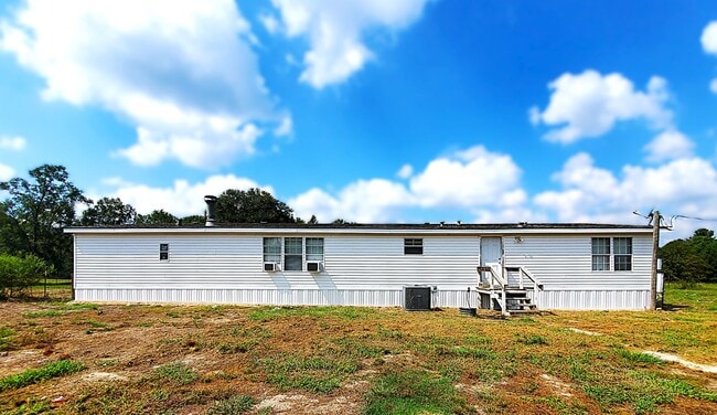 Building Photo - Spacious 4 bedroom with 3 FULL bathrooms nestled on 2 acres! MUST SEE!!!