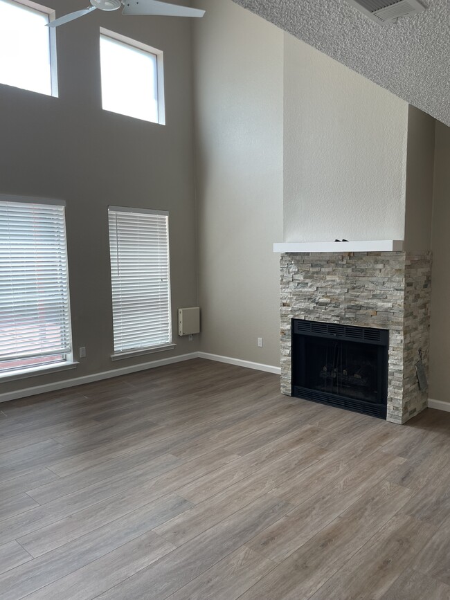 Bright living room with gas fireplace - 1205 W Hudgins St