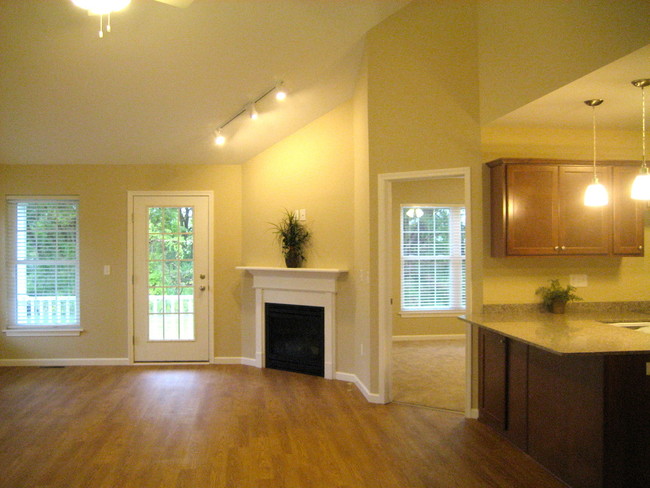 Vaulted ceilings & gas fireplace - Greenwood Townhomes