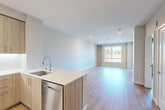 Located at 3567 Ryder St in Santa Clara, CA, this well-designed one-bedroom, one-bathroom unit offers a thoughtfully planned layout across a single floor. The open-concept living and kitchen area creates a seamless flow, anchored by light hardwood-style flooring and neutral-toned walls that lend a clean, modern aesthetic throughout.

The kitchen is a standout feature, equipped with stainless steel appliances including a French door refrigerator, gas range, built-in microwave, and dishwasher. Light wood cabinetry extends to the ceiling, maximizing storage, while a white subway tile backsplash and quartz countertops with a peninsula provide both style and function.

The living area is generously proportioned, benefiting from recessed lighting and a large window that invites natural light and outdoor views of the surrounding greenery. The spacious primary bedroom includes multiple windows and direct access to a private balcony, enhancing the sense of openness.

The bathroom features a clean, minimal design with a shower-tub combination and straightforward white finishes. Light wood flooring flows consistently through the hallway and bedroom, contributing to a cohesive and contemporary feel throughout the unit.