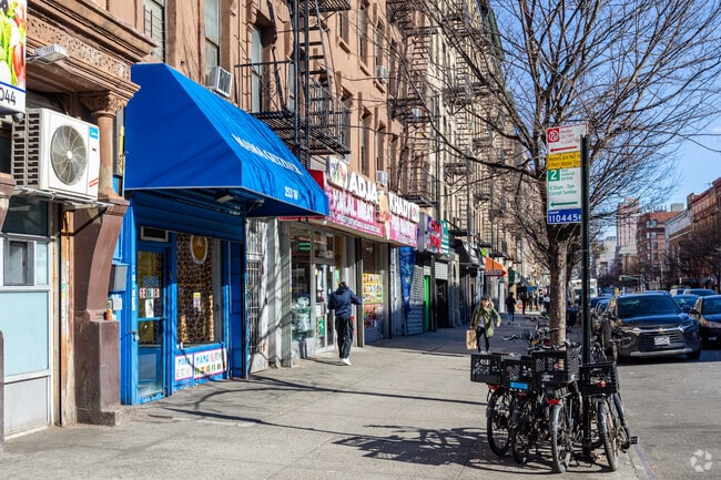 Various retail stores can be found on West 116th Street in Harlem.