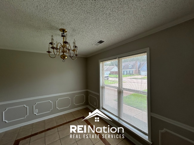 Photo - Spacious 4BR/2BA Near Southwind | High Ceilings, Brick Fireplace & 2-Car Garage House
