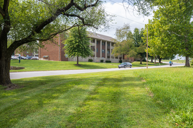 Spacious grounds, beautiful views, and a place to call home. - Wilshire Apartments