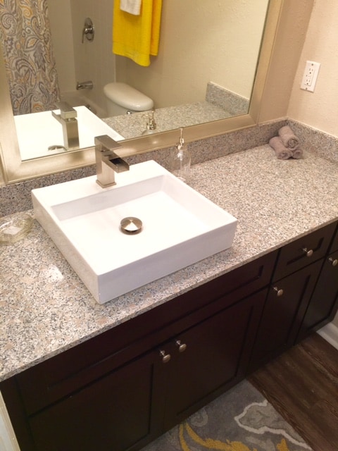 Bathroom upgraded with a square vessel sink - The Arts Apartments at West Napoleon