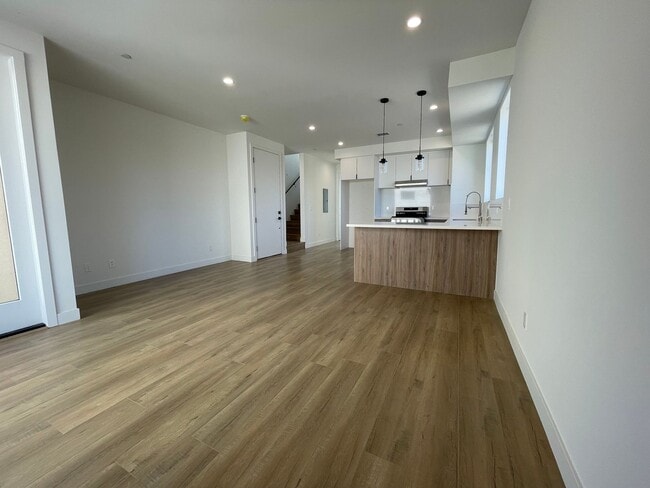 Building Photo - JUST COMPLETED MODERN TOWNHOMES! Never Liv...