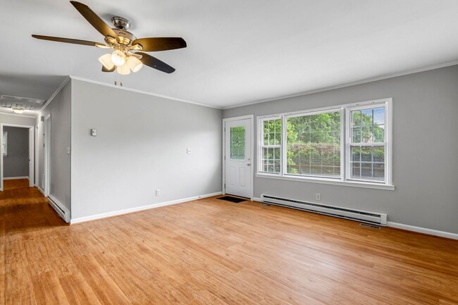Building Photo - Updated Home, Stainless Steel Appliances, Wood Like Flooring, Deck, Garage!