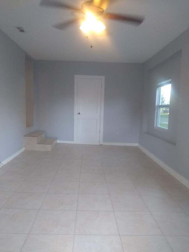 Living Room with Laundry Room at the end - 701 Southwest Blvd N