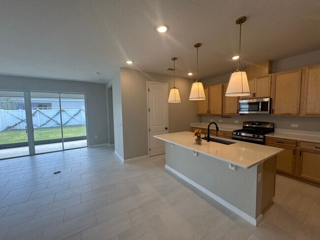 Building Photo - Where Modern Comfort Meets 4BD/3BA Hometown Charm — Your Story Begins in Okahumpka! FULLY-FENCED!...