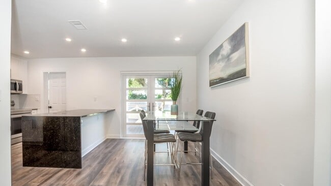 Living room facing towards dining area. - 121 George Bush Blvd