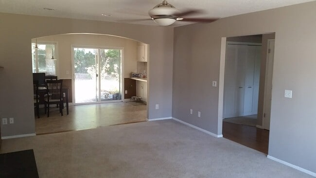 Dining room and kitchen viewed from living room. - 4061 NE Brogden St