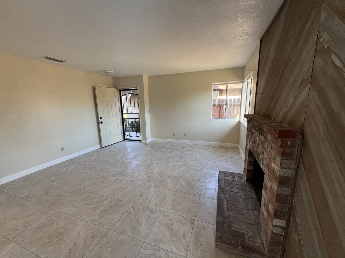 New tile -living room - 7312 Village Green Dr