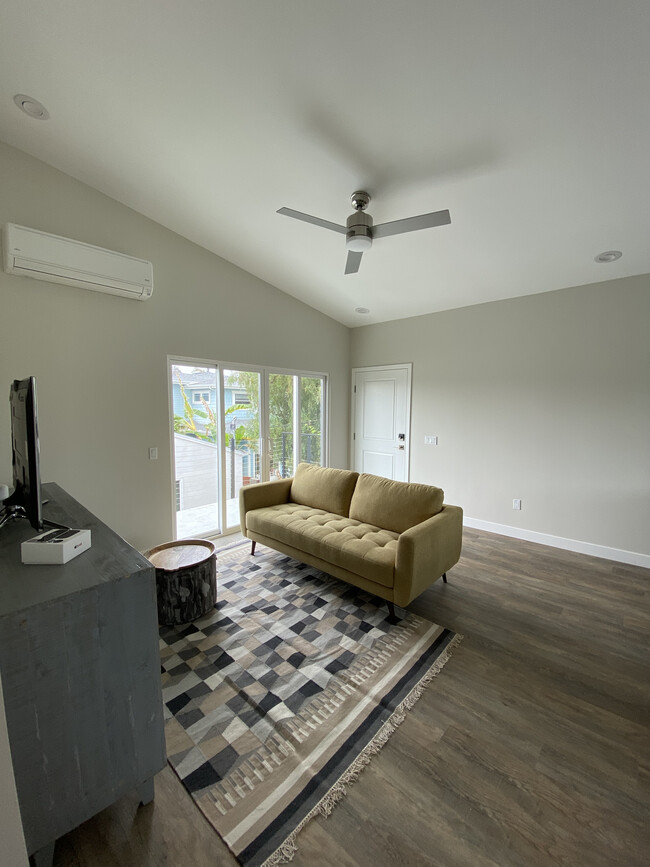 Living room, sliders to deck - 3662 Quimby St