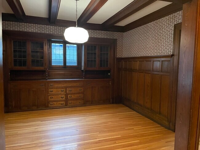 Oak paneled dining room with built-in hutches - 486 Otis Ave