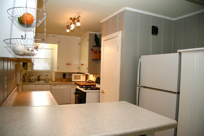 Kitchen includes all appliances, leads to unfinished basement, where washer and dryer. - 5542 Reeds Rd