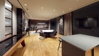 Located at 2500 Fulton Place in Reston, VA, this single-floor amenity lounge is designed with a refined, contemporary aesthetic that blends leisure and sophistication. The space is anchored by a striking billiards table set atop a textured area rug, illuminated by a sleek pendant light fixture overhead, with a wall-mounted flat-screen television nearby for entertainment. Warm hardwood flooring runs throughout, complementing the rich, dark tones of the surrounding design elements.

A dedicated lounge area features a round white marble-topped table encircled by leather and brass-framed chairs, offering an intimate setting for conversation or casual gatherings. Adjacent to this, floor-to-ceiling draped curtains in warm taupe add a sense of elegance and visual depth, while a bold geometric tile accent wall introduces a striking textural contrast.

A wet bar with dark stone countertops and bar-height seating provides a functional entertaining hub, seamlessly integrated into the space. Frosted panel windows along one wall allow diffused natural light to filter in, maintaining a warm and inviting ambiance. Recessed ceiling lighting throughout ensures even, well-balanced illumination. The overall design combines moody, dark accents with warm wood tones to create a polished, club-like atmosphere ideal for socializing and recreation.