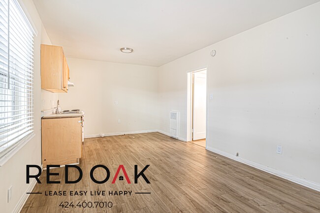 Building Photo - Sun-Drenched One Bedroom with Hardwood Sty...