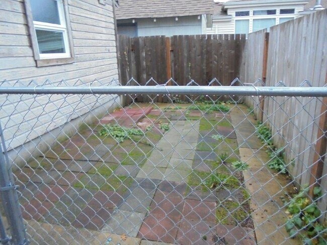 Storage or dog pen (2018) and fully fenced in yard - 10601 Broadway Ave S