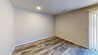This 510 square foot apartment in Wichita, Kansas, offers a thoughtful layout with one bedroom and a living room. The space showcases a mix of flooring materials, with plush carpeting in the bedroom and stylish wood-look flooring in the living areas, adding visual interest and practicality. The primary bedroom, measuring 120 square feet, provides ample space for rest and relaxation.

Throughout the apartment, neutral-toned walls create a bright, airy atmosphere, complemented by textured ceilings that add depth to the rooms. Large windows in both the bedroom and living area allow natural light to flood the space, while offering views of the surrounding area. The living room features vertical blinds for light control and privacy.

Built-in closets with paneled doors offer convenient storage solutions. The apartment's lighting is a blend of recessed fixtures and a decorative ceiling fan, providing both ambient and task lighting options. The overall design emphasizes simplicity and functionality, making efficient use of the available square footage to create a comfortable living environment.