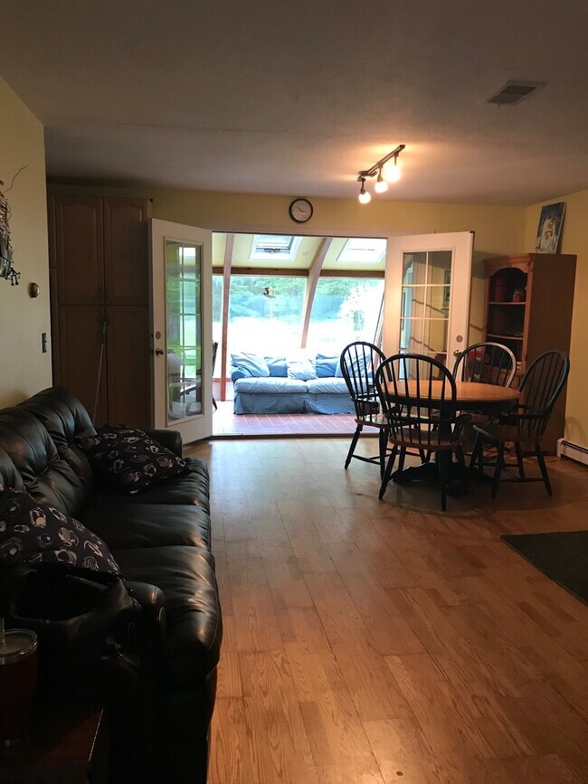 Dining room with sunroom behind - 84 Guinea Rd