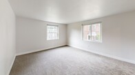 Located at 902 Valley Rd in Elkins Park, PA, this two-bedroom, one-bathroom residence offers a thoughtfully laid-out single-floor plan designed for comfortable everyday living. The interior is finished with neutral, light-toned walls throughout, creating a clean and bright atmosphere that is easy to personalize.

The spacious living room features soft carpeting and large windows that invite ample natural light, offering views of the surrounding neighborhood. A connecting hallway leads to the rest of the unit, providing a clear and functional flow between rooms.

The primary bedroom is generously sized, featuring dual windows on adjacent walls that flood the room with natural light and offer pleasant outdoor views. The second bedroom is also well-proportioned, with its own window and neutral carpeted flooring. Both bedrooms benefit from convenient access to the unit's three closets, providing excellent storage capacity.

The kitchen is efficiently designed with white cabinetry, dark countertops, dark hardwood-style flooring, and black appliances including a gas range and full-size refrigerator. An additional room with hardwood-style flooring and a window rounds out the layout, offering flexible use as needed.

The full bathroom completes this well-organized home, which blends functional design with a clean, move-in-ready aesthetic in a convenient Elkins Park location.