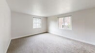 Located at 902 Valley Rd in Elkins Park, PA, this two-bedroom, one-bathroom residence offers a thoughtfully laid-out single-floor plan designed for comfortable everyday living. The interior is finished with neutral, light-toned walls throughout, creating a clean and bright atmosphere that is easy to personalize.

The spacious living room features soft carpeting and large windows that invite ample natural light, offering views of the surrounding neighborhood. A connecting hallway leads to the rest of the unit, providing a clear and functional flow between rooms.

The primary bedroom is generously sized, featuring dual windows on adjacent walls that flood the room with natural light and offer pleasant outdoor views. The second bedroom is also well-proportioned, with its own window and neutral carpeted flooring. Both bedrooms benefit from convenient access to the unit's three closets, providing excellent storage capacity.

The kitchen is efficiently designed with white cabinetry, dark countertops, dark hardwood-style flooring, and black appliances including a gas range and full-size refrigerator. An additional room with hardwood-style flooring and a window rounds out the layout, offering flexible use as needed.

The full bathroom completes this well-organized home, which blends functional design with a clean, move-in-ready aesthetic in a convenient Elkins Park location.