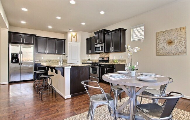 Open living / dining / kitchen - 8840 Jayden Dr NE