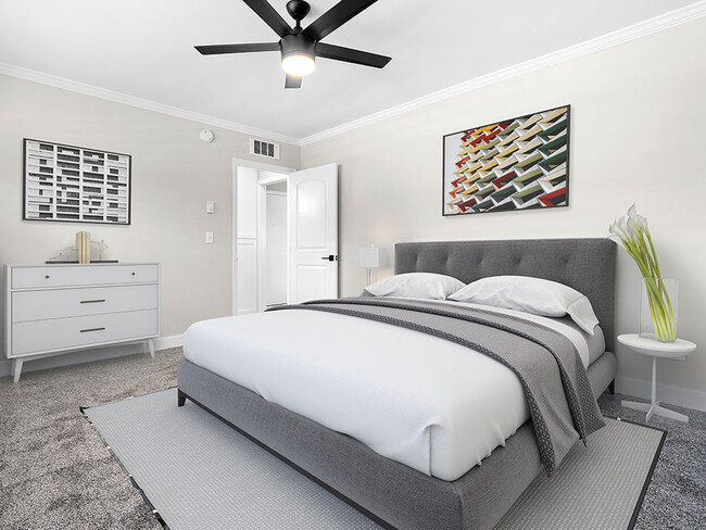 Carpeted bedroom with ceiling fan. - 1249 South Bundy