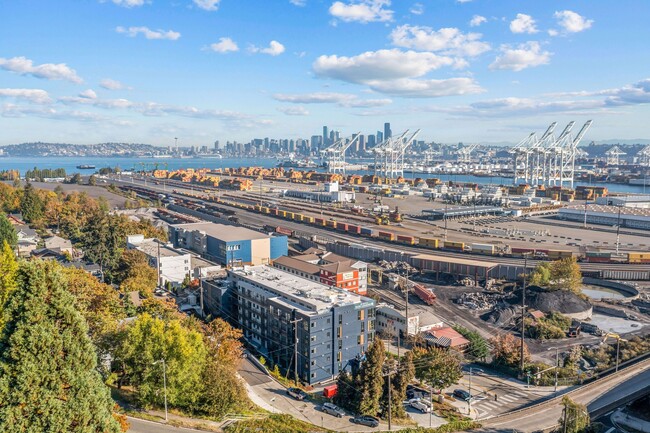 Take in the stunning aerial view of the port, showcasing the vibrant surroundings and the proximity of Harbor Flats to the waterfront. - Harbor Flats