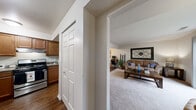 Located at 1820 Wessel Ct in St. Charles, IL, this well-designed 2-bedroom, 1-bathroom residence offers a thoughtfully laid-out single-floor plan. The living room serves as the heart of the home, featuring plush carpeting, neutral-toned walls, and a large sliding glass door that floods the space with natural light and opens to a private balcony overlooking lush, mature trees. The kitchen is equipped with warm wood cabinetry, granite-style countertops, stainless steel appliances including a refrigerator and dishwasher, and durable hardwood-style flooring. The spacious primary bedroom features carpeted floors, a wide window with outdoor views, and its own private sliding door access to a second balcony, offering a tranquil retreat. The second bedroom is a cozy, carpeted space with ample room for furnishings. Both bedrooms benefit from good closet storage. The full bathroom is finished with tile flooring, a wood-toned vanity, and a full tub-shower combination. A connecting hallway links all rooms efficiently. The outdoor balconies provide peaceful views of the surrounding greenery, enhancing the overall sense of calm and connection to nature throughout this inviting residence.