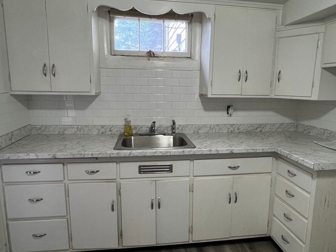 New kitchen sink and countertop. New applicances to be delivered the end of next week. - 353 Lawton St