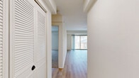 This 510 square foot apartment in Columbia, MD offers a efficient living space with modern amenities. The single-floor layout features a bedroom, bathroom, living room, kitchen, and closet. The kitchen showcases contemporary design with white cabinetry, subway tile backsplash, granite countertops, and stainless steel appliances including a gas range and dishwasher. The living area boasts wood-look flooring and a ceiling fan, with sliding glass doors leading to a balcony. The bedroom, measuring 140 square feet, is carpeted and includes a window for natural light. The bathroom features a white tub/shower combination with a curved shower rod. Throughout the apartment, crisp white walls create a bright, airy atmosphere. The property at 5764 Stevens Forest Rd combines functionality with modern aesthetics, offering a cozy yet stylish living space ideal for singles or couples seeking a low-maintenance lifestyle in a convenient location.