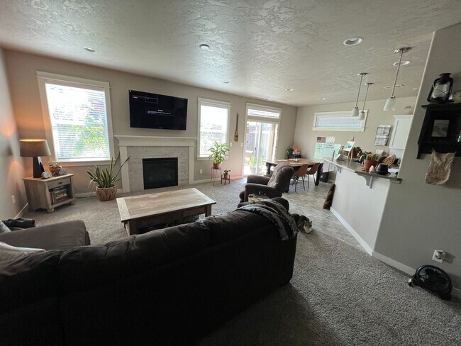 Building Photo - Single level, triple car garage and A/C!
