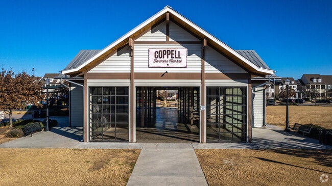 Exterior of Coppell Farmers Branch with a large yard in Coppell.