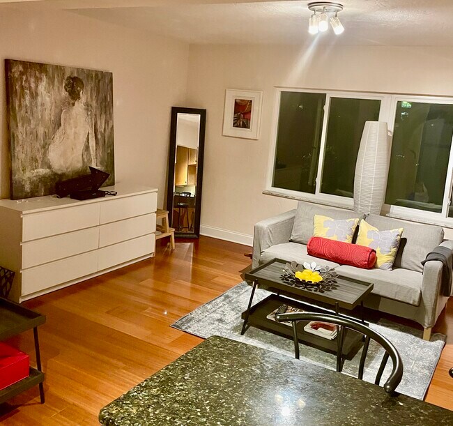 The living room at night evokes a sleek and sexy vibe. - 210 5th Ave S