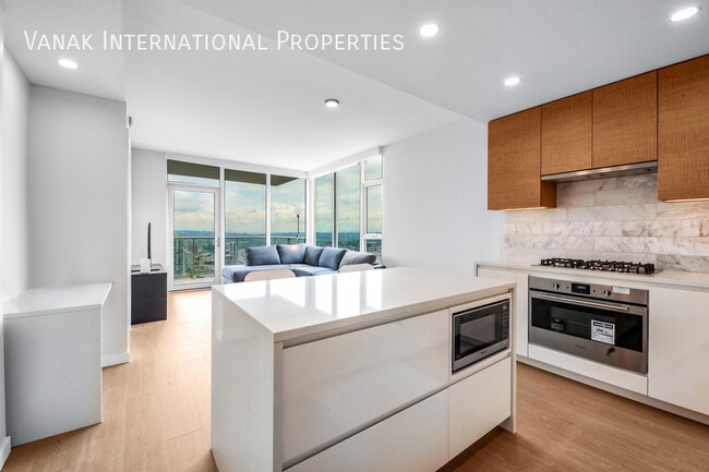 Building Photo - Luxury 2 Bed + Den Corner Home on the 52nd Floor at Gilmore Place