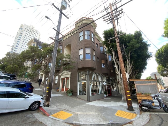 Building Photo - REMODELED, Corner 2BR. IN-UNIT LAUNDRY! Di...