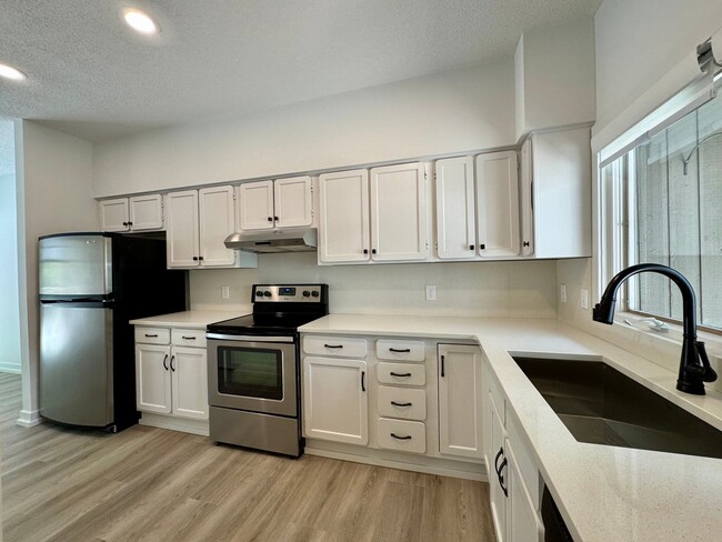 Building Photo - Spacious 2-Story Falconbridge Condo with Private Courtyard and Resort-Style Amenities
